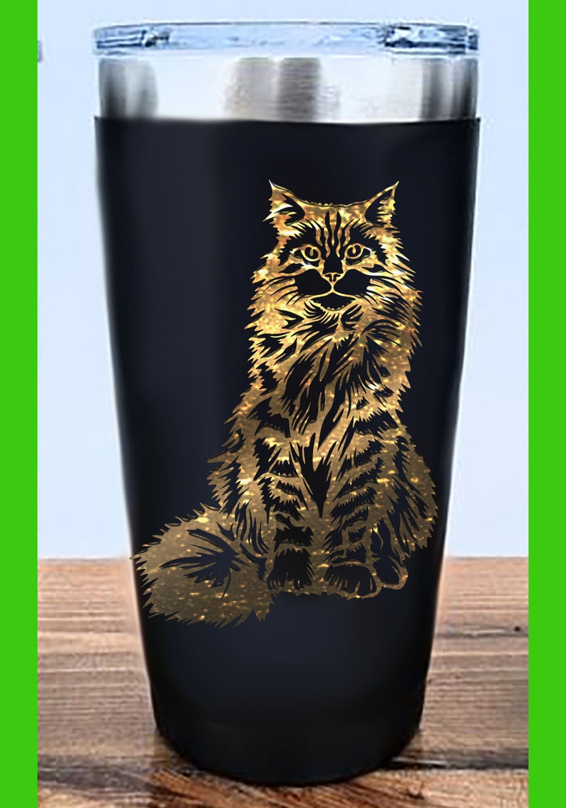 May include: A black stainless steel tumbler with a gold glitter design of a cat sitting.