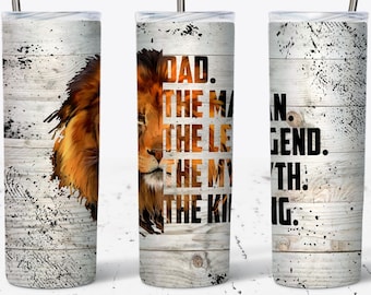 May include: A white stainless steel tumbler with a wood grain pattern and a lion graphic. The tumbler has the text "DAD. THE MAN. THE LEGEND. THE MYTH. THE KING." printed on it.