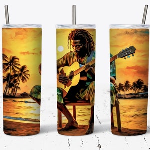 May include: A stainless steel tumbler with a colorful design featuring a man playing a guitar on a beach at sunset. The design includes palm trees, a body of water, and a yellow sky.
