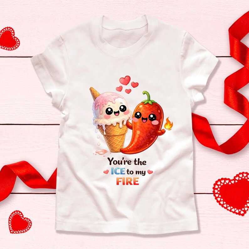 May include: White t-shirt featuring a cute cartoon ice cream cone and a red chili pepper, both with smiling faces. The text "You're the ICE to my FIRE" is printed below the characters. Red hearts are scattered above the characters.