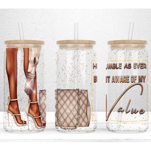 May include: Three clear tumblers with gold glitter and a straw. The tumblers have a wooden lid. The first tumbler has a drawing of a woman's legs in high heels. The second tumbler has a drawing of a brown handbag with a gold chain. The third tumbler has the text "Humble as ever but aware of my value" in gold lettering.