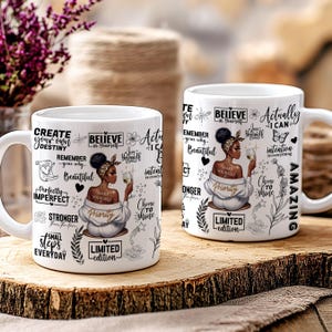 May include: Two white ceramic mugs with black and gold lettering and illustrations. The mugs feature a black woman with a gold crown and a gold necklace. The text on the mugs includes the phrases "Believe in Yourself", "Make Yourself a Priority", "Choose to Shine", "Actually I Can", "Create Your Own Destiny", "Remember Your Why", "Perfectly Imperfect", "Stronger From the Storm", "Small Steps Everyday", and "Limited Edition".