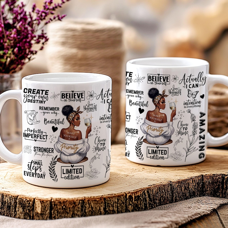 May include: Two white ceramic mugs with black and gold lettering and illustrations. The mugs feature a black woman with a gold crown and a gold necklace. The text on the mugs includes the phrases "Believe in Yourself", "Make Yourself a Priority", "Choose to Shine", "Actually I Can", "Create Your Own Destiny", "Remember Your Why", "Perfectly Imperfect", "Stronger From the Storm", "Small Steps Everyday", and "Limited Edition".