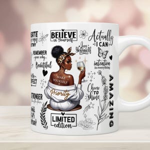 May include: White ceramic mug with a black and gold design featuring a woman with a glass of wine and inspirational quotes such as "Believe in Yourself", "Love Yourself", "Make Yourself a Priority", "Choose to Shine", "Actually I Can", "Limited Edition", and "Amazing".