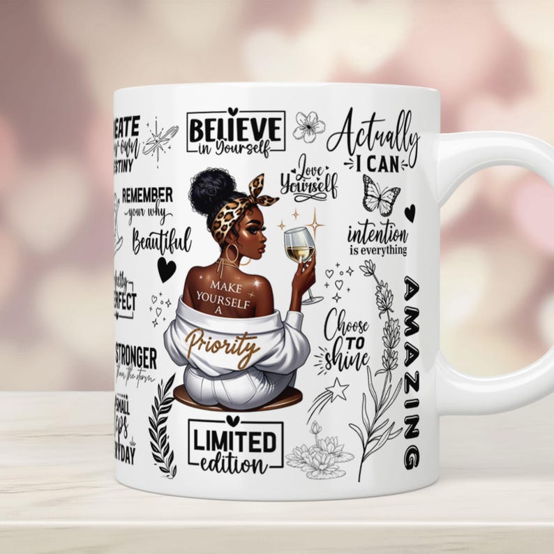 May include: White ceramic mug with a black and gold design featuring a woman with a glass of wine and inspirational quotes such as "Believe in Yourself", "Love Yourself", "Make Yourself a Priority", "Choose to Shine", "Actually I Can", "Limited Edition", and "Amazing".