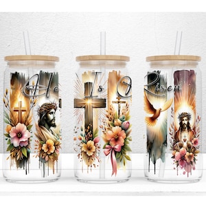 May include: Three glass tumblers with wooden lids and straws. Each tumbler features a different design with religious themes, including crosses, Jesus, and the words "He is Risen". Floral accents and watercolor effects add to the design.