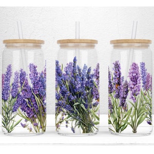 May include: Three clear glass tumblers with bamboo lids and straws. Each tumbler features a design of purple lavender flowers with green stems.
