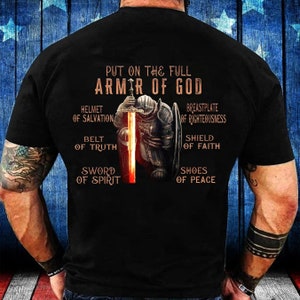 May include: Black t-shirt with a graphic of a knight in armor with the text "Put on the full armor of God" and a list of the armor pieces: Helmet of Salvation, Belt of Truth, Sword of Spirit, Breastplate of Righteousness, Shield of Faith, Shoes of Peace.