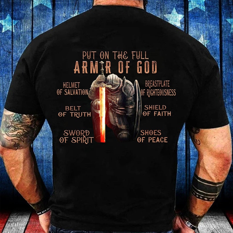May include: Black t-shirt with a graphic of a knight in armor with the text "Put on the full armor of God" and a list of the armor pieces: Helmet of Salvation, Belt of Truth, Sword of Spirit, Breastplate of Righteousness, Shield of Faith, Shoes of Peace.