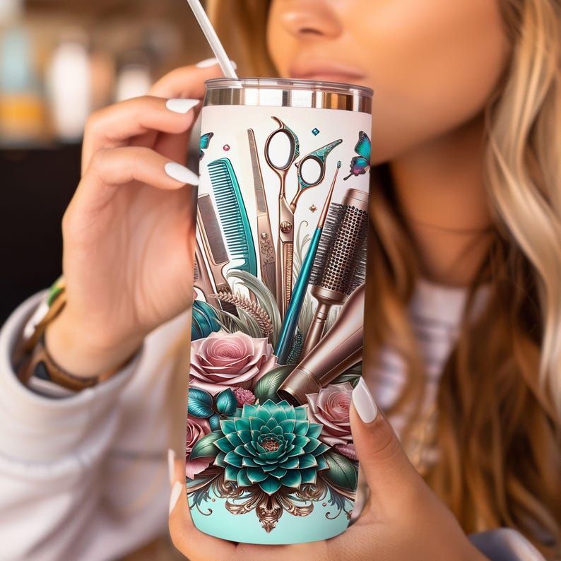 May include: A stainless steel tumbler with a colorful design featuring hairdressing tools, including scissors, combs, and a blow dryer. The design also includes a butterfly and floral elements.