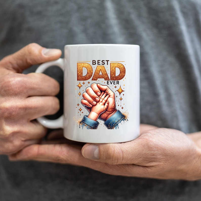 May include: White ceramic coffee mug with a gold glitter design that says "Best Dad Ever" with a father and child holding hands.