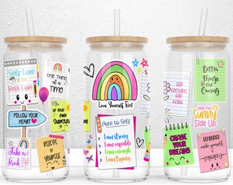 May include: Three clear glass tumblers with bamboo lids and straws. Each tumbler is decorated with colorful stickers featuring positive affirmations and motivational quotes. The stickers include phrases like "Self Love is the Best Love", "Love Yourself First", "Keep the Sunny Side Up", and "Chase Your Dreams".