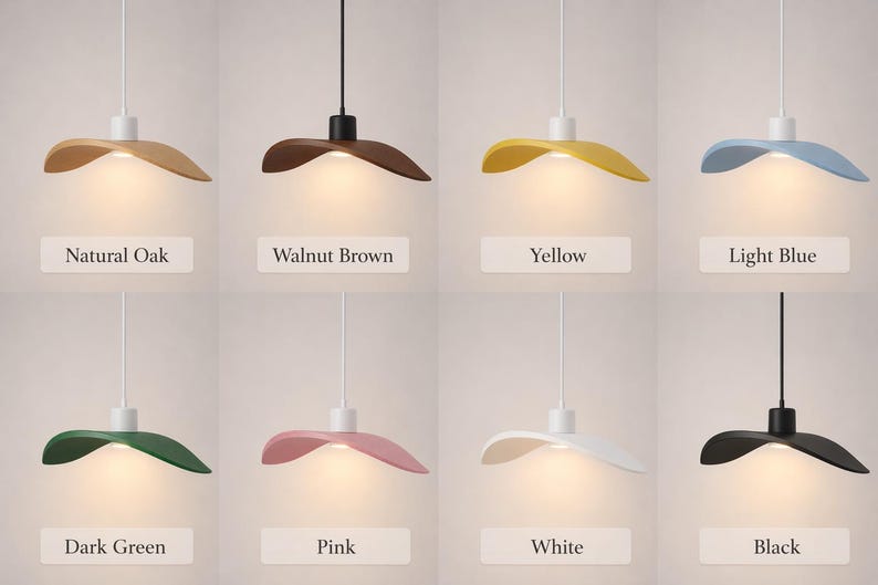 May include: Eight pendant lights in various colors: natural oak, walnut brown, yellow, light blue, dark green, pink, white, and black. Each light has a unique hat-shaped shade and a white or black cord. The labels below each light indicate the color.