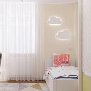 May include: A white bed with a white headboard and a white footboard. The bed has a white and blue striped bedspread and a pink pillow with the words "Hello Summer" on it. There are two white cloud-shaped lights on the wall behind the bed.