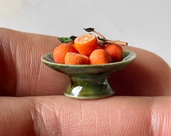 Oranges in ceramic plate