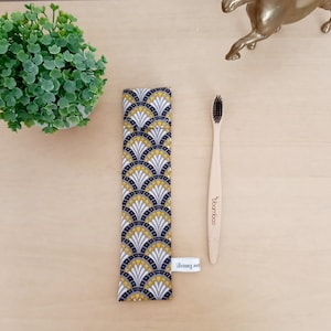 Etui à brosse à dent éventail jaune et blanc