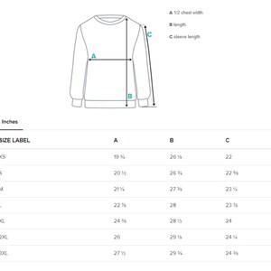 Op de afbeelding: Maattabel voor een sweatshirt met maten in inches voor borstbreedte, lengte en mouwlengte. De maten omvatten XS, S, M, L, XL, 2XL en 3XL.