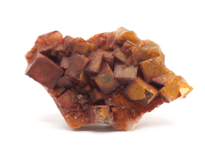 Fluorite cluster 75mm x 45mm (84 grams). Unique and special. Cubes. Ethically found and fair trade. Hematite layer. Crystals from Morocco.