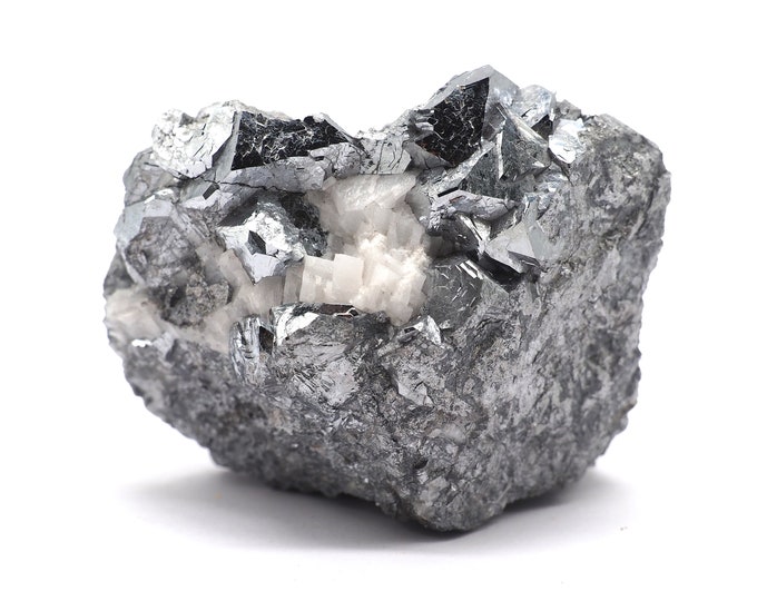 Skuterudite with quartz 75mm x 55mm (489 grams). Rare! Good quality. Ethically sourced and fair trade mineral. Cluster of skuterudite.