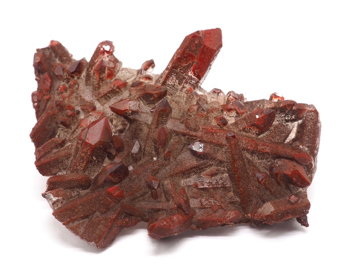 Rock crystal cluster with hematite layer 95mm x 75mm - 100 grams. Ethically sourced and fair trade mineral. From mine to market.