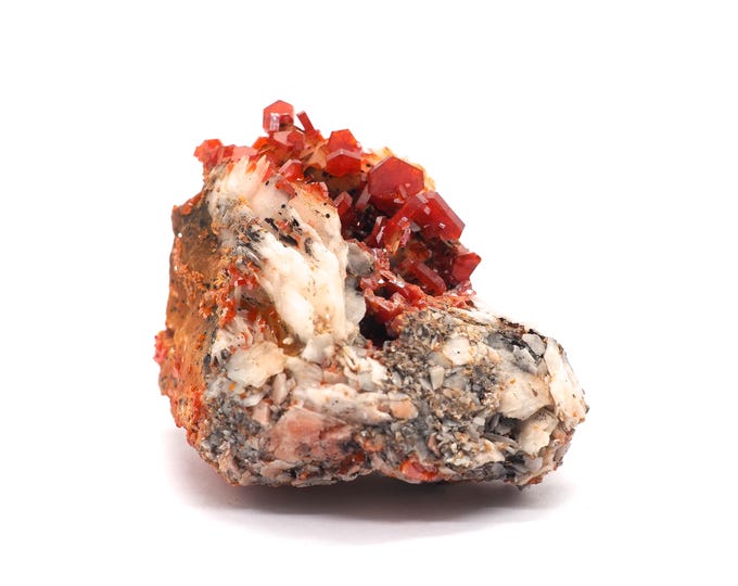 Vanadinite Barite 60mm x 45mm (87 grams). Bright red crystals on barite. Ethically sourced and fair trade mineral. Morocco, Mibladen.