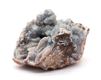 May include: A close-up of a natural mineral specimen. The rock features a mix of textures and colors, with a base of brown and reddish-brown hues. The top is covered in a light blue, crystalline formation, creating a unique contrast.