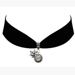May include: A black velvet choker with a silver charm featuring a bee and a clock face.