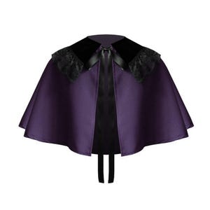 May include: A deep purple capelet featuring a black velvet collar with black lace trim along the edges. The garment includes a black satin ribbon tie closure at the center front neckline, with the ribbon ends hanging down vertically.