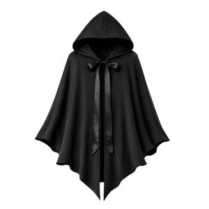 May include: A solid black hooded cape featuring a pointed hemline and a smooth satin ribbon tie closure at the neckline. The garment is constructed with a draped, flowing silhouette that extends from the hood down to the asymmetrical bottom edge.