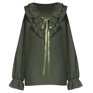 May include: A green long-sleeved blouse with a ruffled collar and a green satin bow tie.