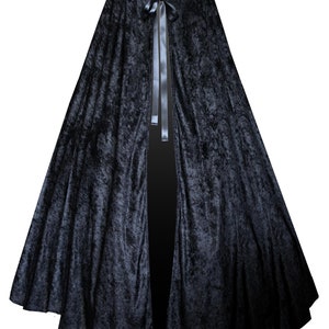 May include: A black velvet hooded cape with a satin ribbon tie.