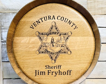 Custom sign made from authentic bourbon barrel lid.