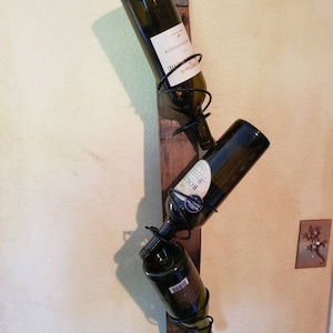 Rustic wine rack made from authentic reclaimed wine/whiskey barrels.