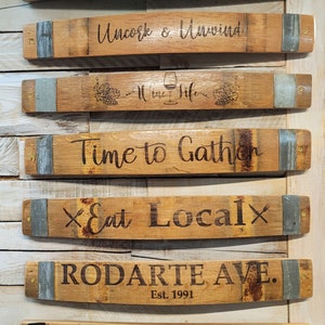 Rustic/farm country style custom signs with slogan, saying, or family name laser engraved on authentic reclaimed Wine/Whiskey Barrel stave.