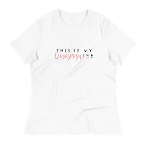May include: White t-shirt with the text "This is my Quarantee" in black and pink lettering.