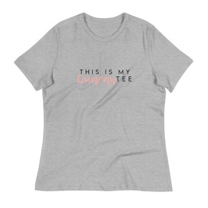 May include: A heather gray t-shirt with the text "This is my Quarantee" in black and pink.
