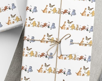 May include: White wrapping paper featuring a repeating horizontal pattern of colorful cartoon animals including bears, kangaroos, and birds. The paper is tied with brown twine and includes white star and heart-shaped gift tags.