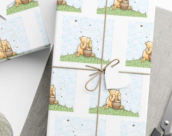May include: Gift-wrapped presents with a repeating pattern of a cartoon bear holding a honey pot. The gifts are tied with twine and adorned with star and heart-shaped tags. A spool of twine and scissors are also visible.