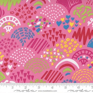 May include: Pink fabric with a colorful, abstract design. The pattern includes white dots, red hearts, blue hearts, yellow circles, and green and red lines. The fabric has a ruler along the bottom.