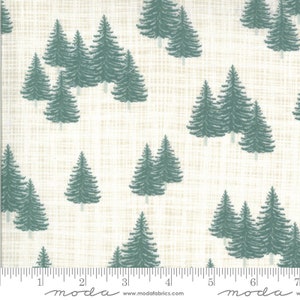 May include: A white fabric with a subtle woven texture features a repeating pattern of dark green pine trees. The fabric is marked with a ruler and the word "moda" in a script font.