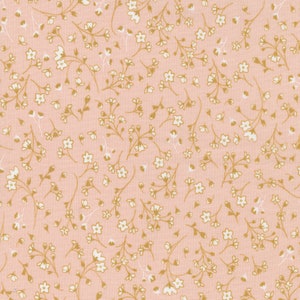May include: A pink fabric with a white and gold floral pattern. The pattern is a small, delicate floral print.
