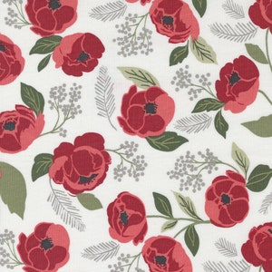 May include: A fabric with a repeating floral pattern. The design features large, deep red flowers with dark centers, green leaves, and gray accents on a white background. The flowers are stylized and arranged in a scattered layout.