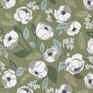 May include: A green fabric with a white floral pattern. The flowers are stylized and have a gray center. The background is a muted green.