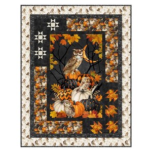 May include: A rectangular quilt featuring a central panel with owls, pumpkins, and autumn leaves against a dark background. The border includes star patterns, repeating owl motifs, and orange leaf shapes on a cream and black fabric background.