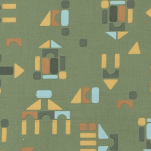 May include: A green fabric with a repeating pattern of geometric shapes in shades of brown, yellow, blue, and gray. The shapes resemble building blocks.