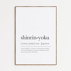 May include: A printable poster with a definition of the Japanese word "shinrin-yoku", which means "forest bathing". The poster is printed in black text on a white background and framed with a brown wooden frame.