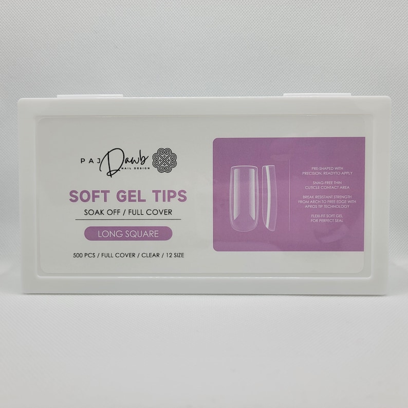 May include: A white box containing 500 clear, long square soft gel nail tips. The box has a pink background with the text "PAJ Dawb Nail Design" and "Soft Gel Tips Soak Off/Full Cover Long Square 500 PCS/Full Cover/Clear/12 Size".