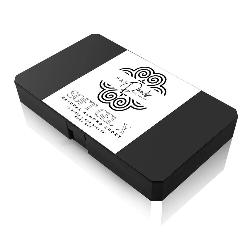 May include: A black rectangular box with a white label. The label features the text "SOFT GEL X NATURAL ALMOND SHORT" and the brand name "PAJ DAWB NAIL DESIGN". The box contains 600 pieces in 14 sizes.