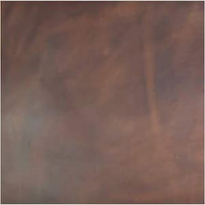 May include: A close-up of a brown leather surface with a subtle, mottled texture.