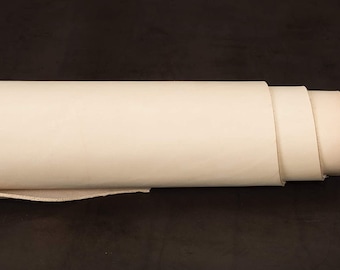 May include: A roll of off-white leather, rolled up and ready for crafting projects.